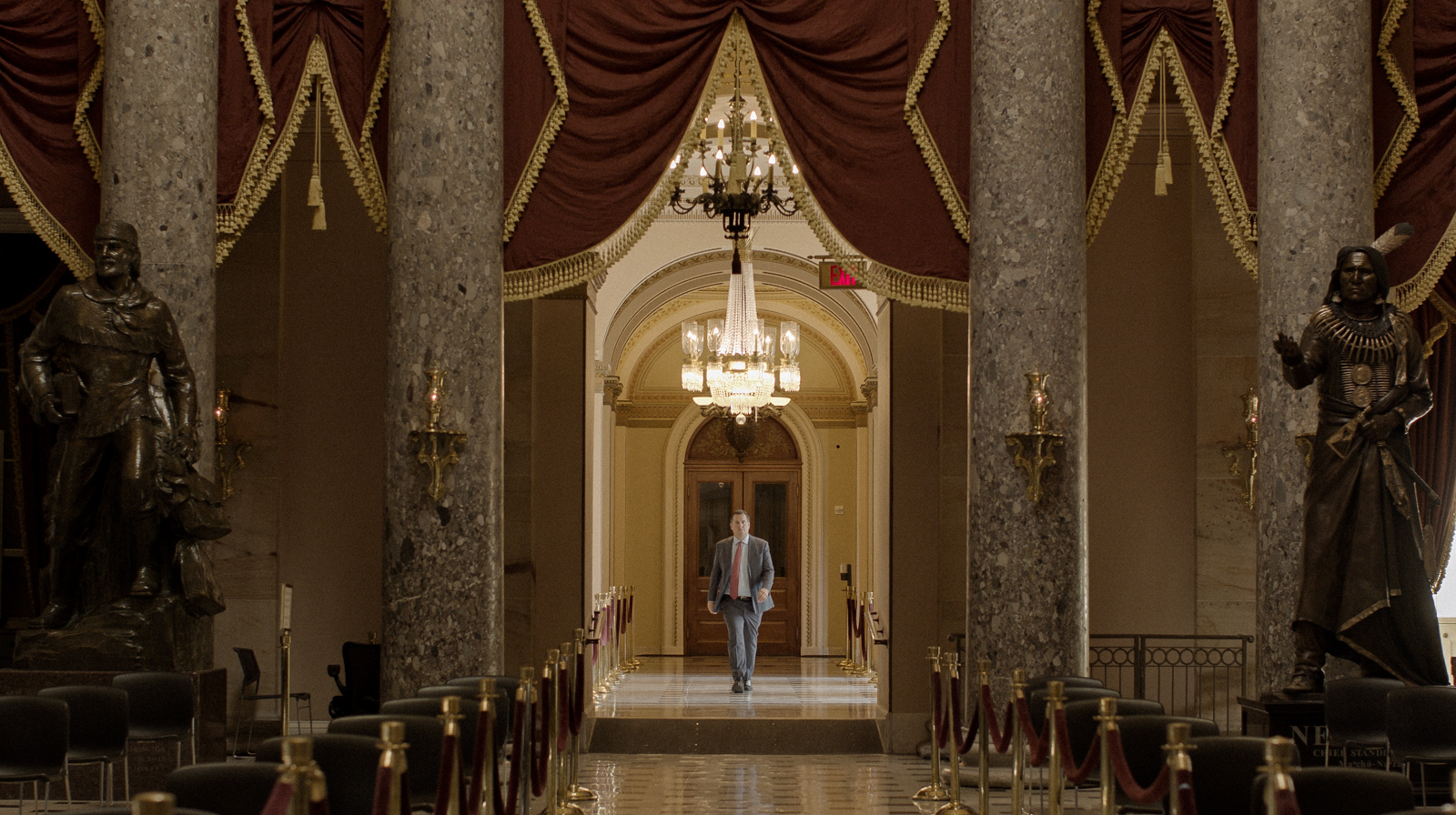 Devin Nunes walking through Statuary Hall in a scene from The Plot Against the President